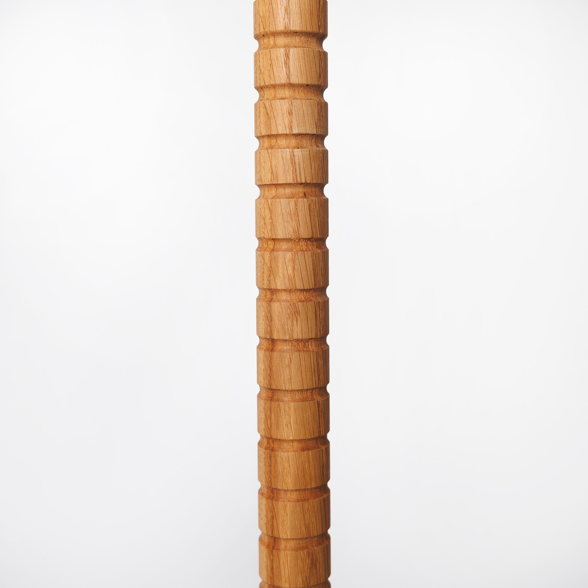 Detalj av ekstaven på Eos processionsljusstake från Hi Unity